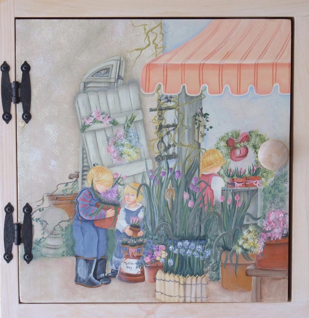 Folk art cabinet door hand-painted with children at a flower market stall