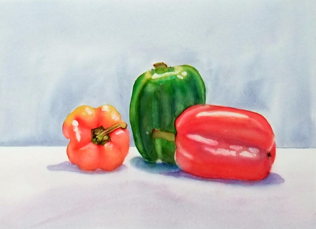 Watercolour still life of red, green, and orange bell peppers