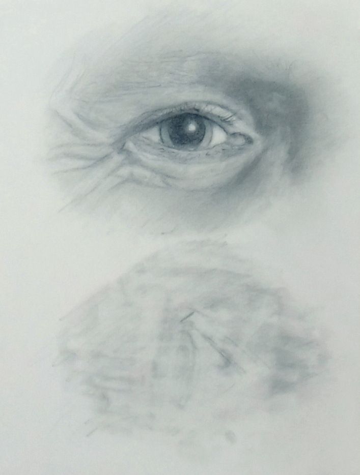 Detailed graphite study of a human eye and the surrounding skin