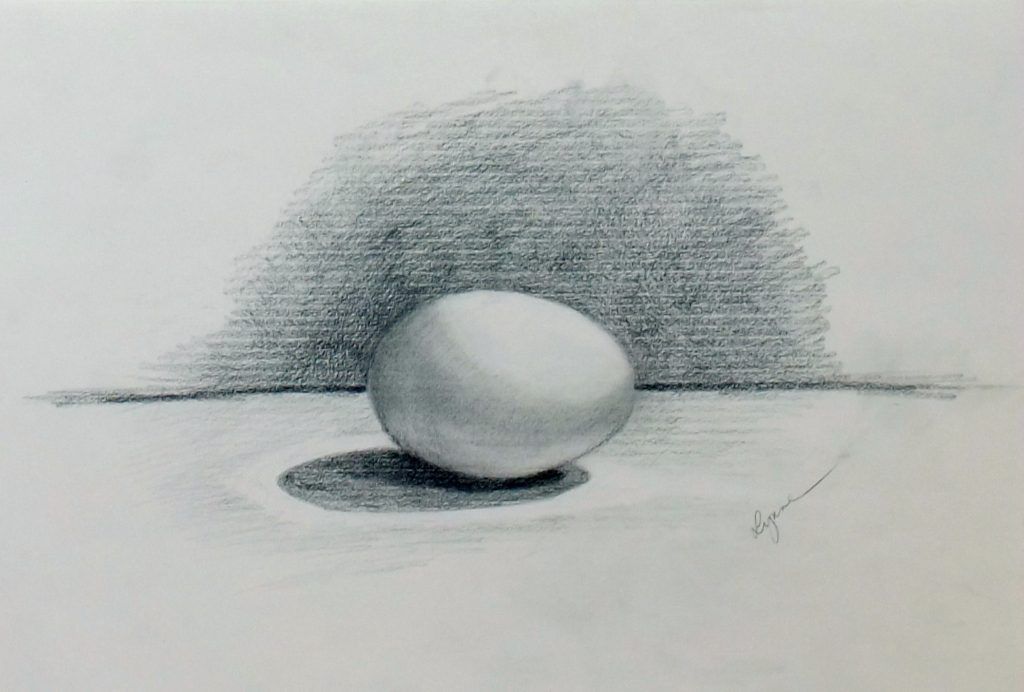 Graphite tonal study of a single egg casting a shadow