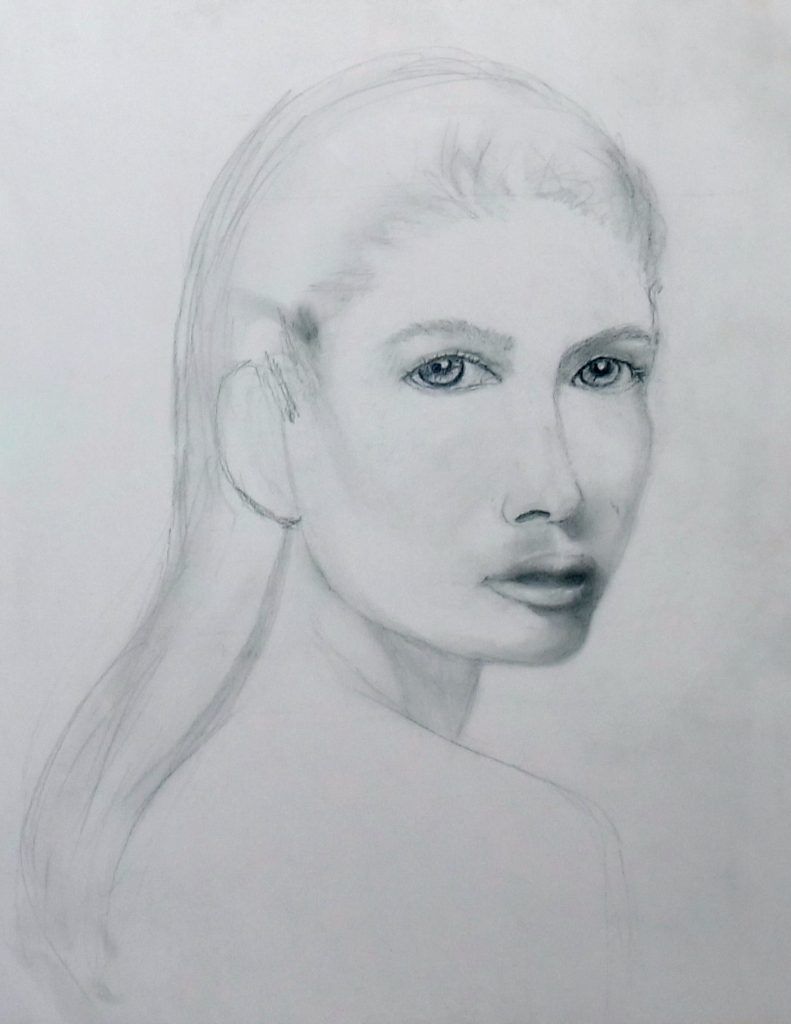 Graphite portrait of a woman with long hair, head and shoulders