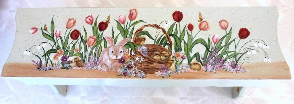 Folk art bench hand-painted with spring tulips, a rabbit, and a nest