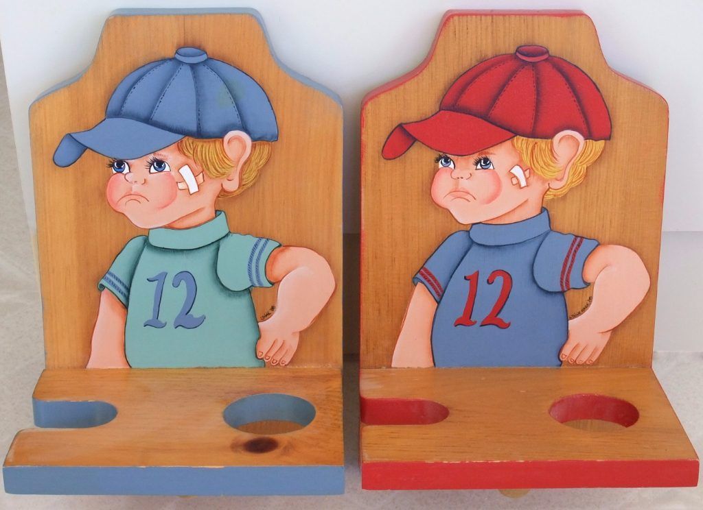 Pair of folk art wooden shelves hand-painted with a boy in a baseball cap