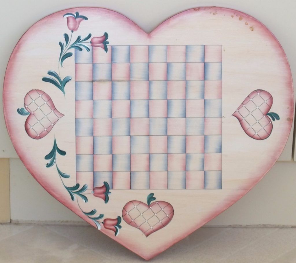 Heart-shaped folk art checkerboard hand-painted with tulips and hearts