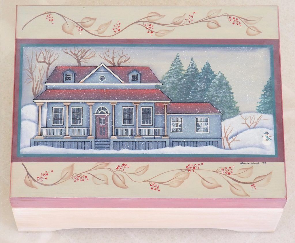 Folk art wooden box hand-painted with a winter house and evergreen trees