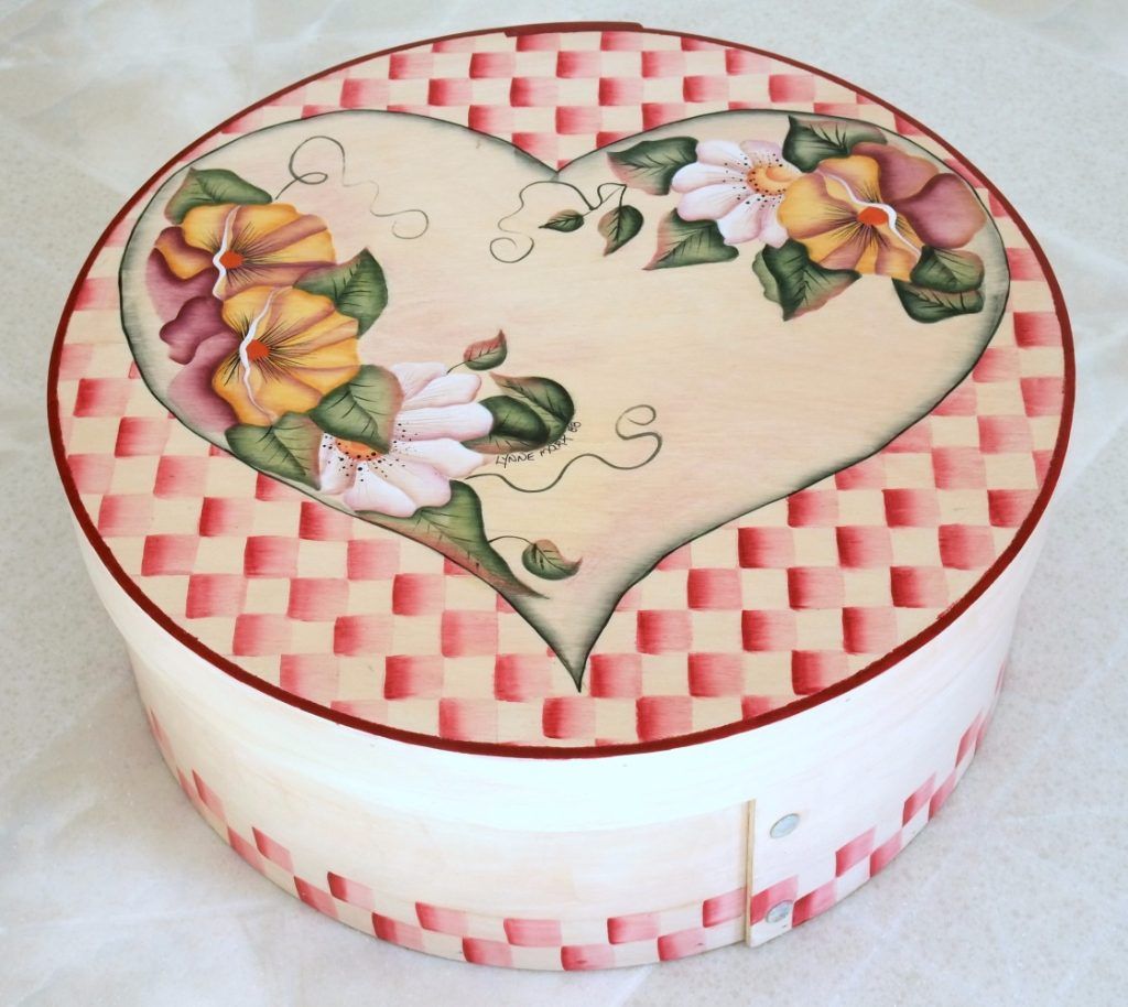 Round folk art box hand-painted with a floral heart and pink check pattern
