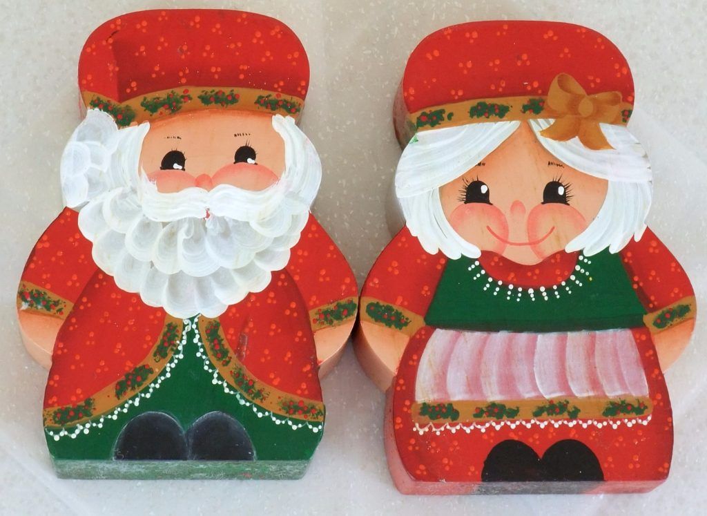 Folk art wooden block figures of Santa and Mrs. Claus