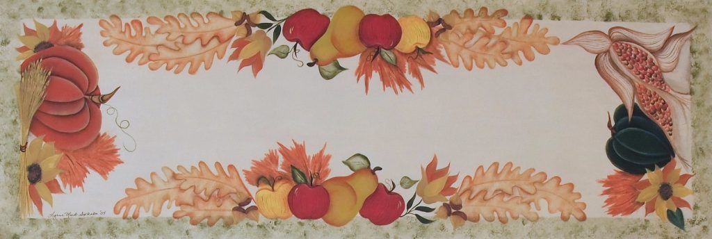 Folk art table runner hand-painted with pumpkins, apples, and autumn leaves