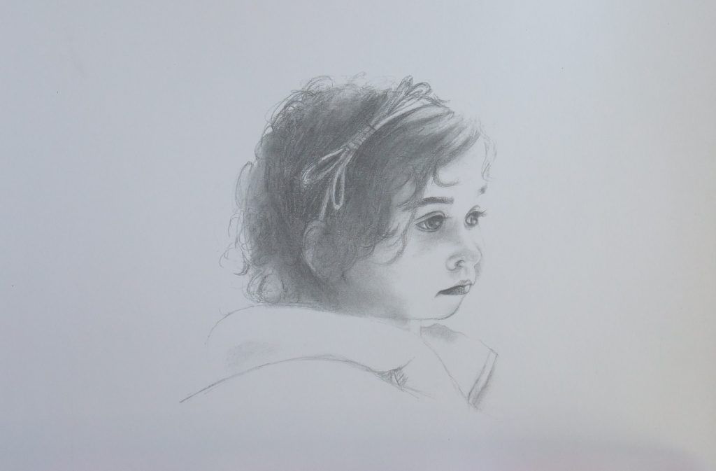Graphite portrait of a young child glancing over one shoulder